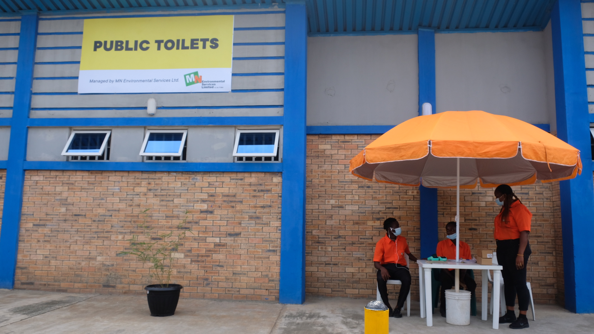 MN Cashier at the public toilet facility at Abule Egba Bus Terminal Lagos.